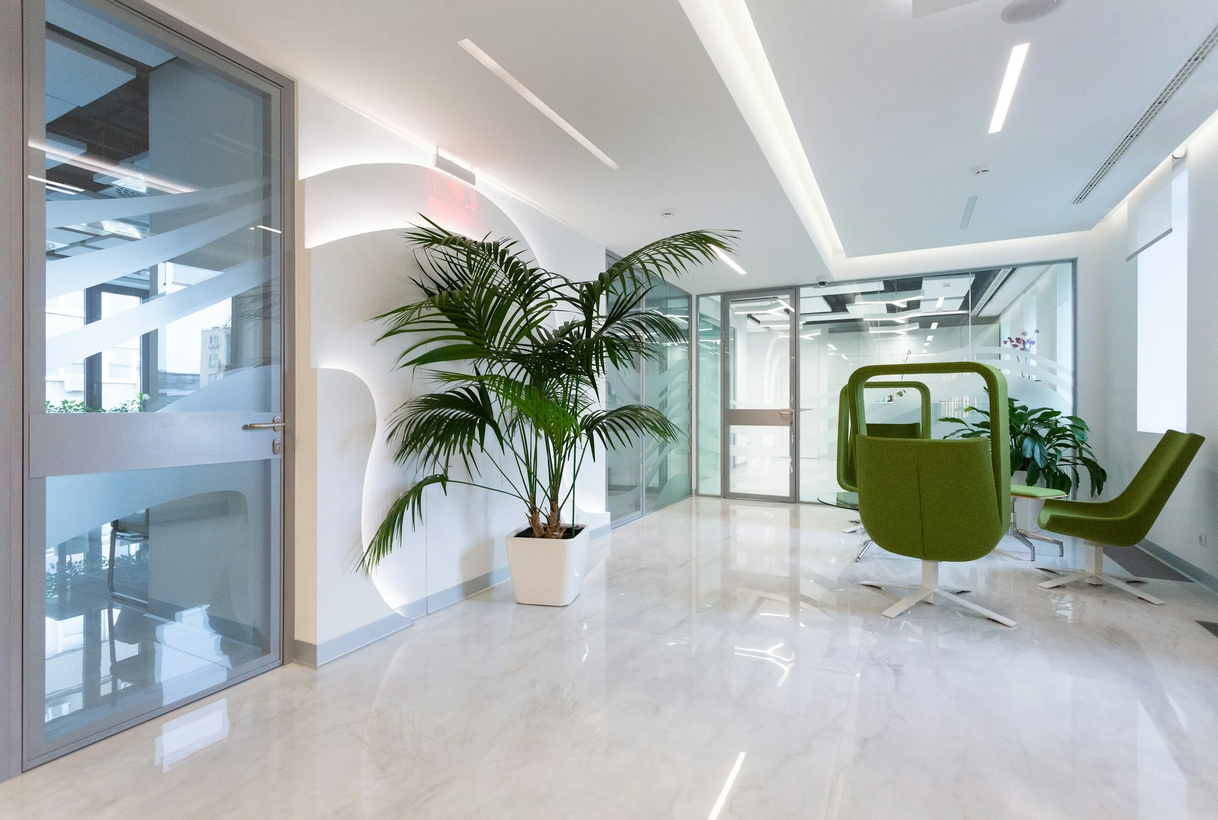 A calm, modern consulting space with natural light and seating